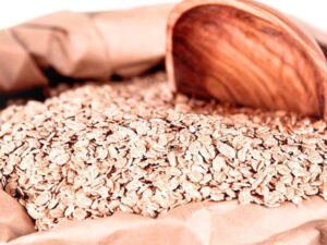 Bulk red wheat flakes displayed for commercial food processing