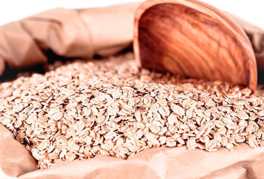 Bulk red wheat flakes displayed for commercial food processing