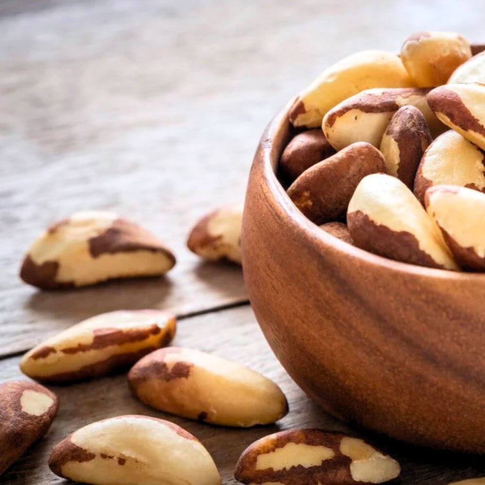 Premium Brazilian almonds served in a wooden bowl for wholesale export and food processing